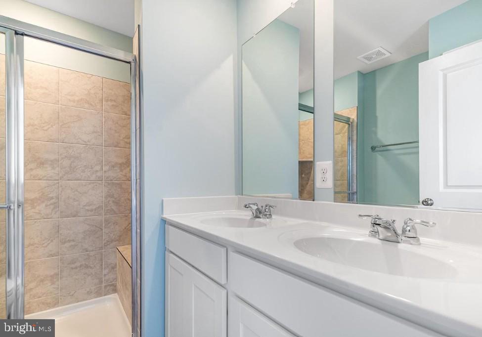 154 Cooperage Road Inwood, WV 25428 - Photo 15 of 19 a bathroom with a sink and a mirror
