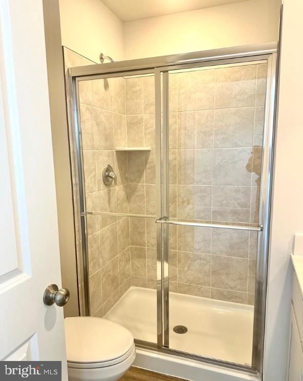 154 Cooperage Road Inwood, WV 25428 - Photo 16 of 19 a bathroom with a shower a toilet and a shower