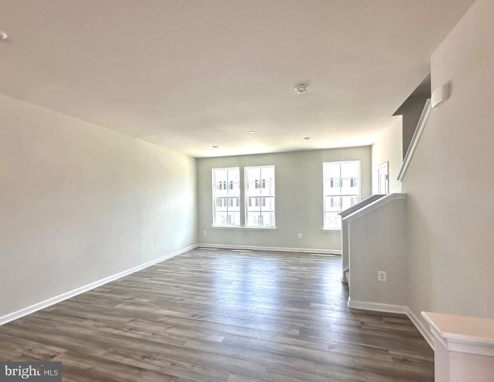 154 Cooperage Road Inwood, WV 25428 - Photo 5 of 19 a view of an empty room with wooden floor and window