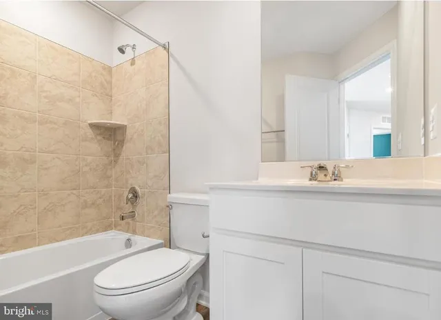 a bathroom with a sink a toilet and a bathtub