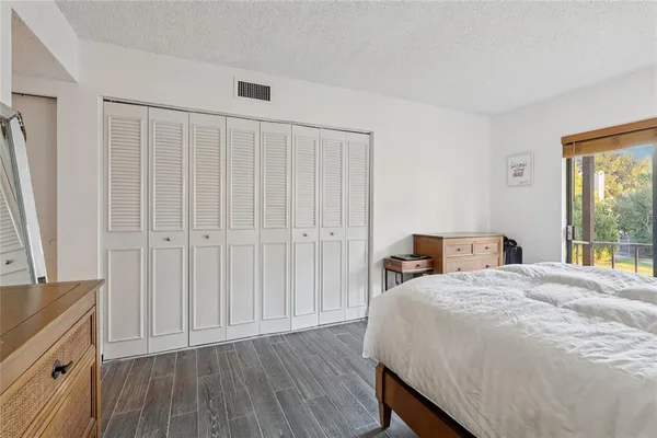 a bathroom with a sink a toilet and shower curtain