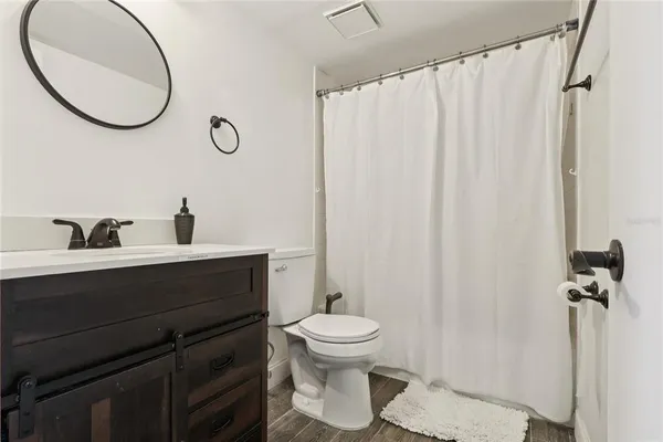 a bedroom with a bed and cabinets