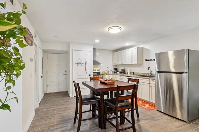 a kitchen with a table and chairs