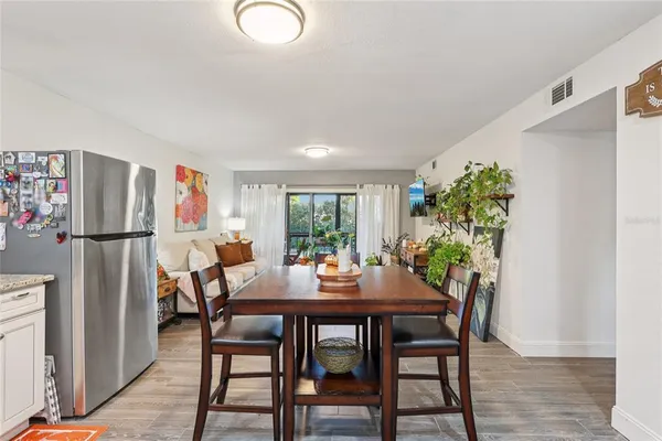 a dining room with furniture and window