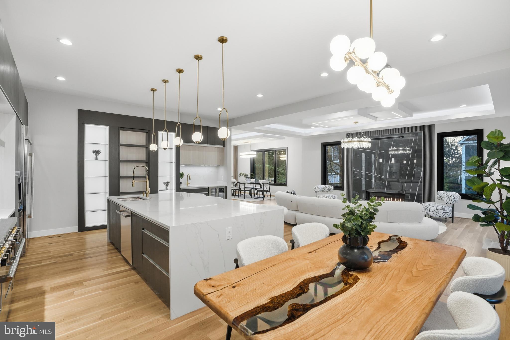 1805 Franklin Avenue McLean, VA 22101 - Photo 32 of 96 a large white kitchen with a large island oven a stove and a chandelier