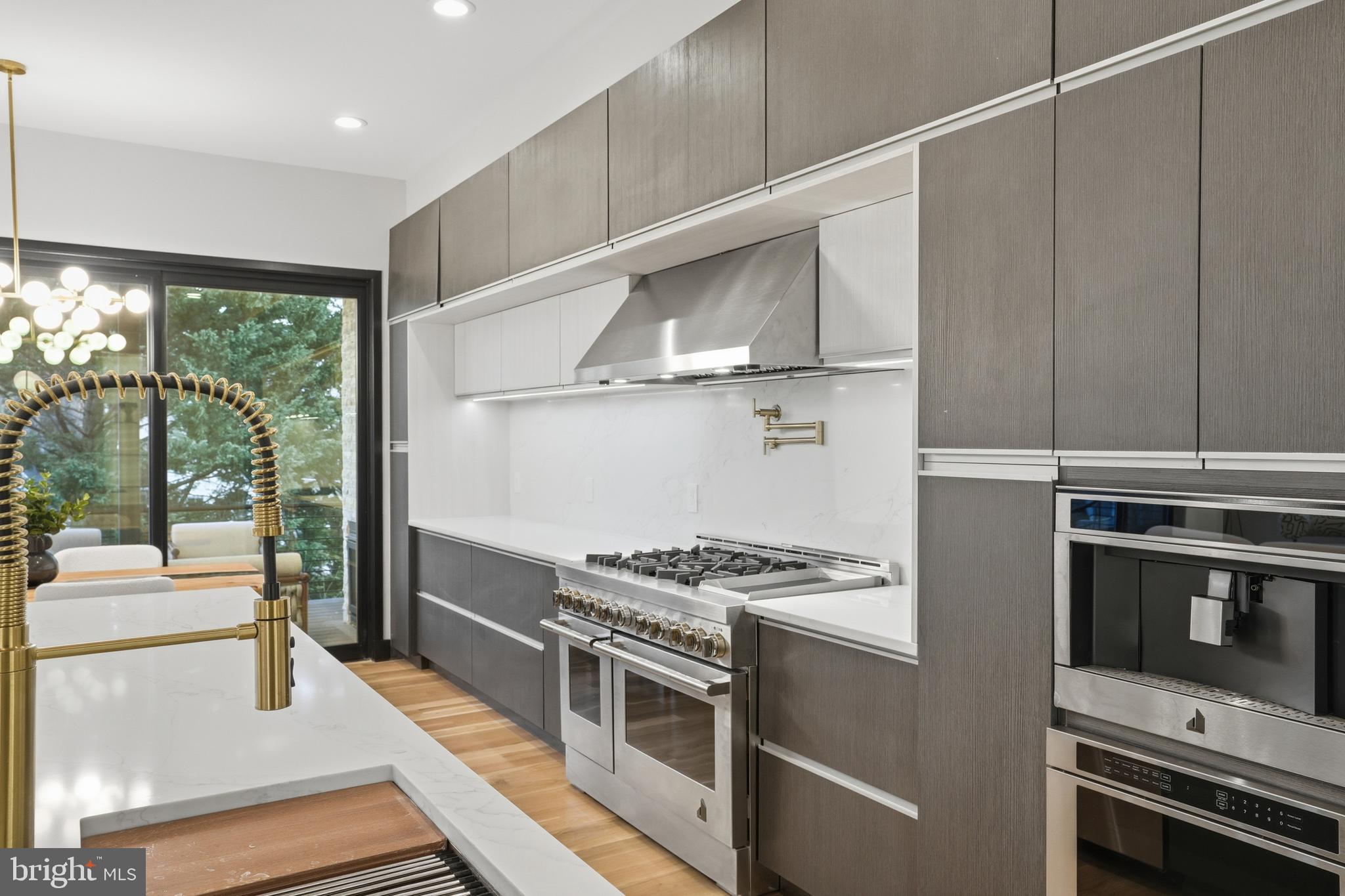 1805 Franklin Avenue McLean, VA 22101 - Photo 35 of 96 a kitchen with stainless steel appliances a stove and a refrigerator