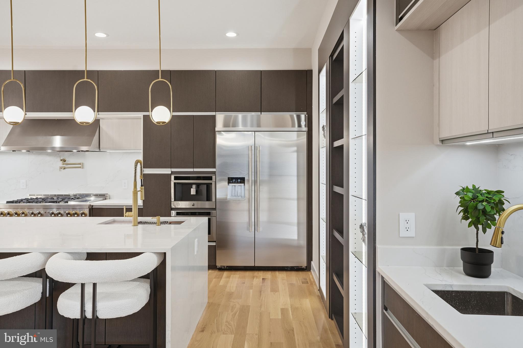 1805 Franklin Avenue McLean, VA 22101 - Photo 36 of 96 a kitchen with stainless steel appliances granite countertop a sink a stove and a refrigerator