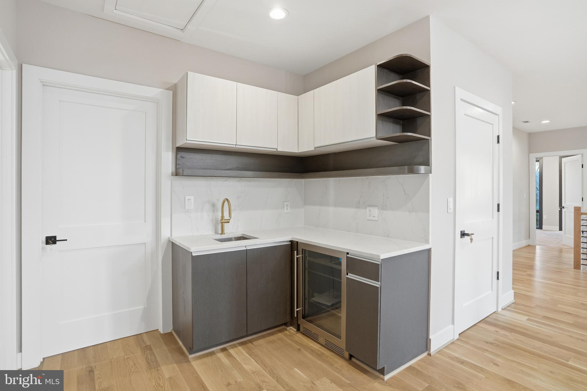 1805 Franklin Avenue McLean, VA 22101 - Photo 46 of 96 a kitchen with stainless steel appliances granite countertop a sink and a refrigerator