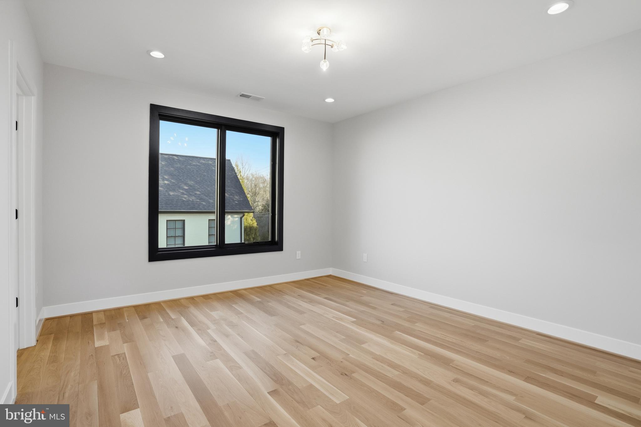 1805 Franklin Avenue McLean, VA 22101 - Photo 49 of 96 a view of an empty room with wooden floor and a window
