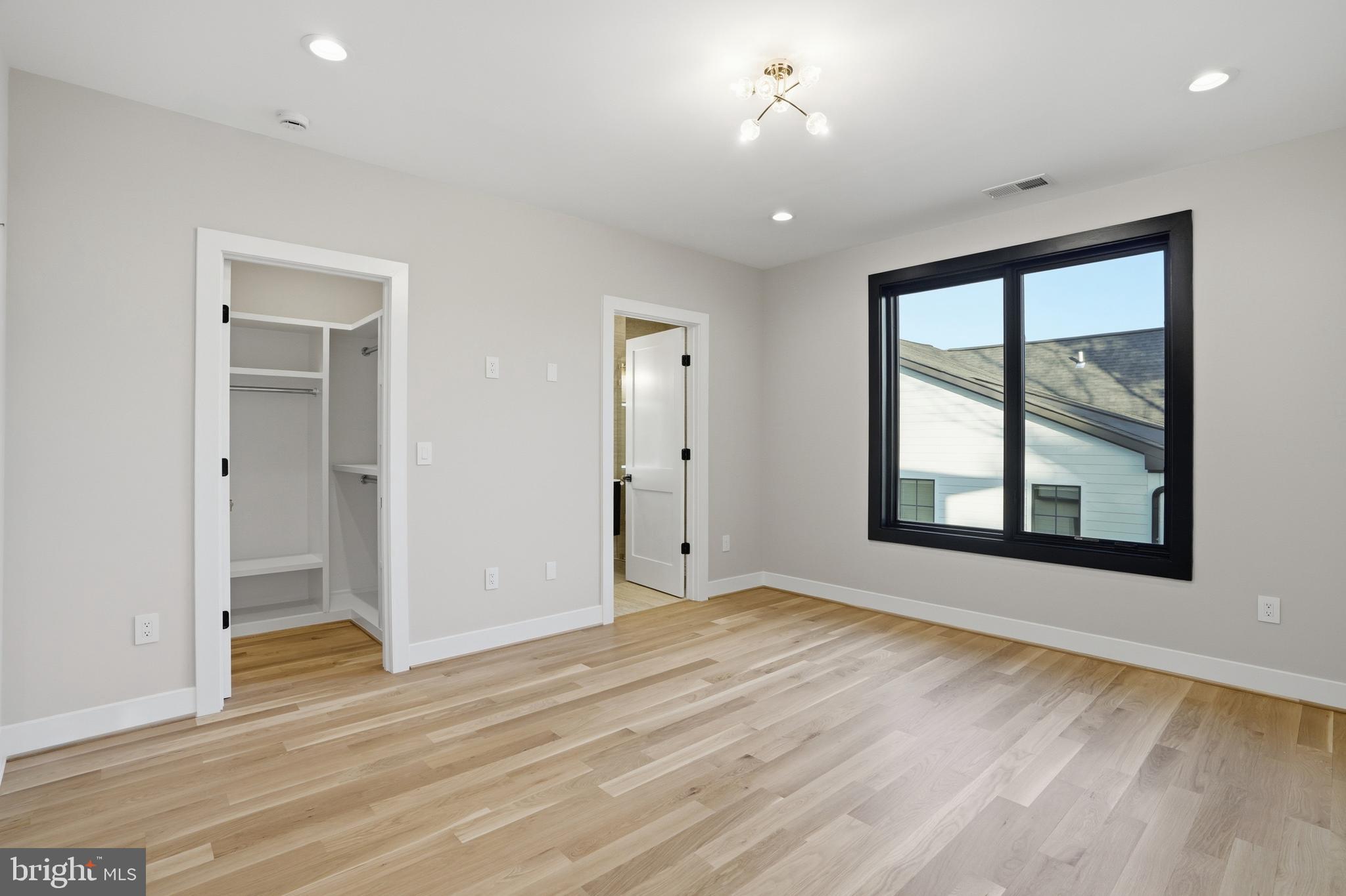 1805 Franklin Avenue McLean, VA 22101 - Photo 51 of 96 a view of an empty room with a window and wooden floor