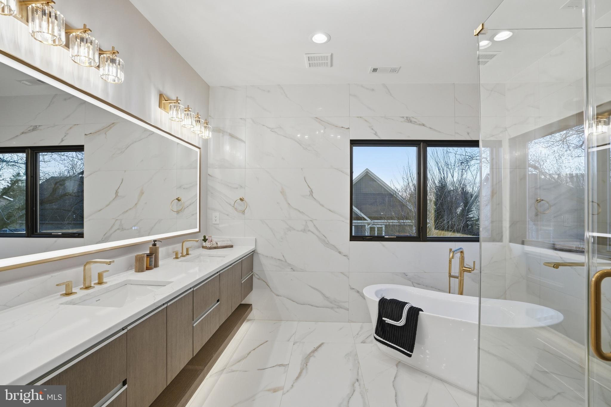 1805 Franklin Avenue McLean, VA 22101 - Photo 66 of 96 a bathroom with a sink a large mirror and a bathtub