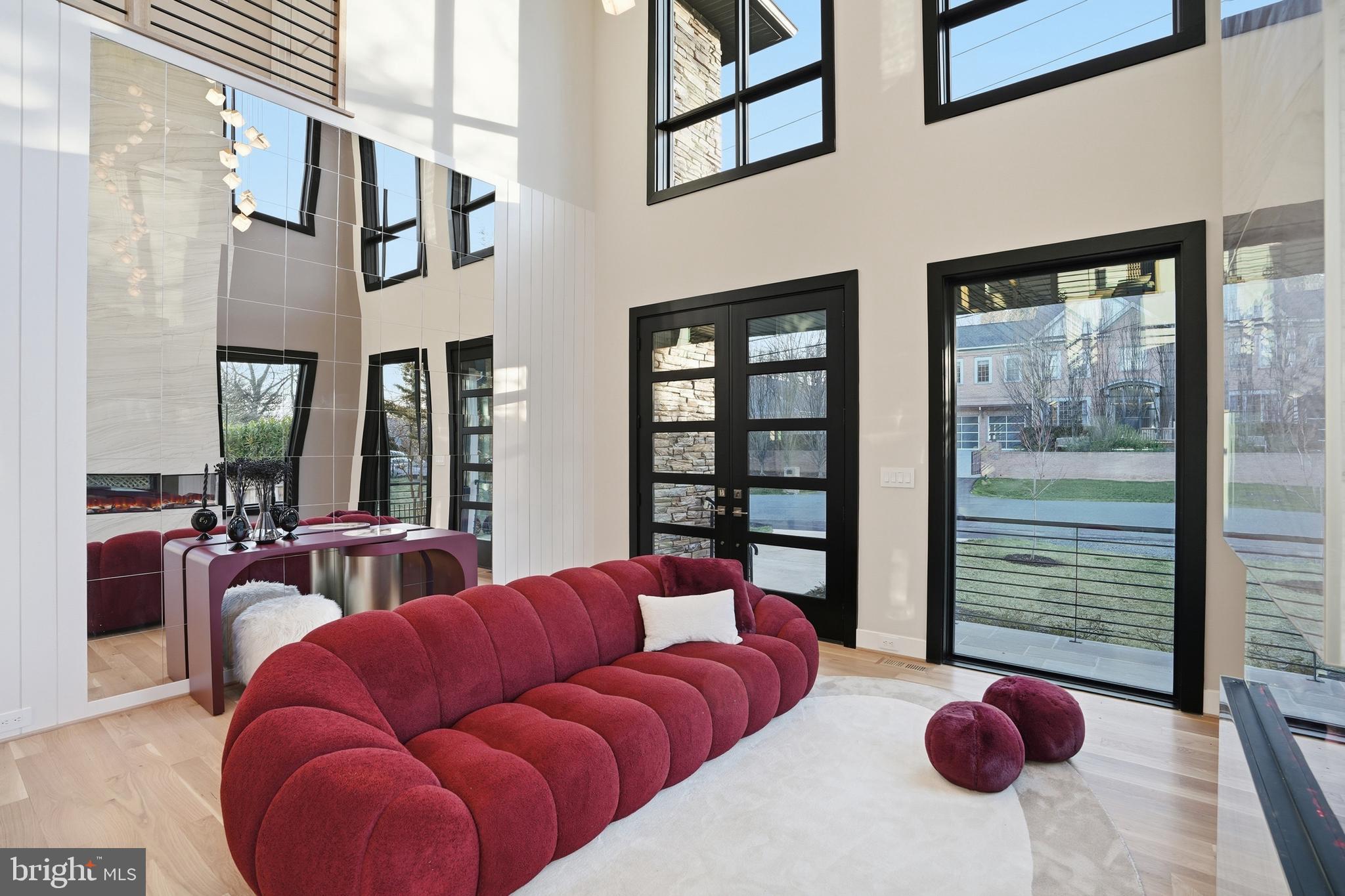 1805 Franklin Avenue McLean, VA 22101 - Photo 7 of 96 a living room with furniture a floor to ceiling window and a chandelier