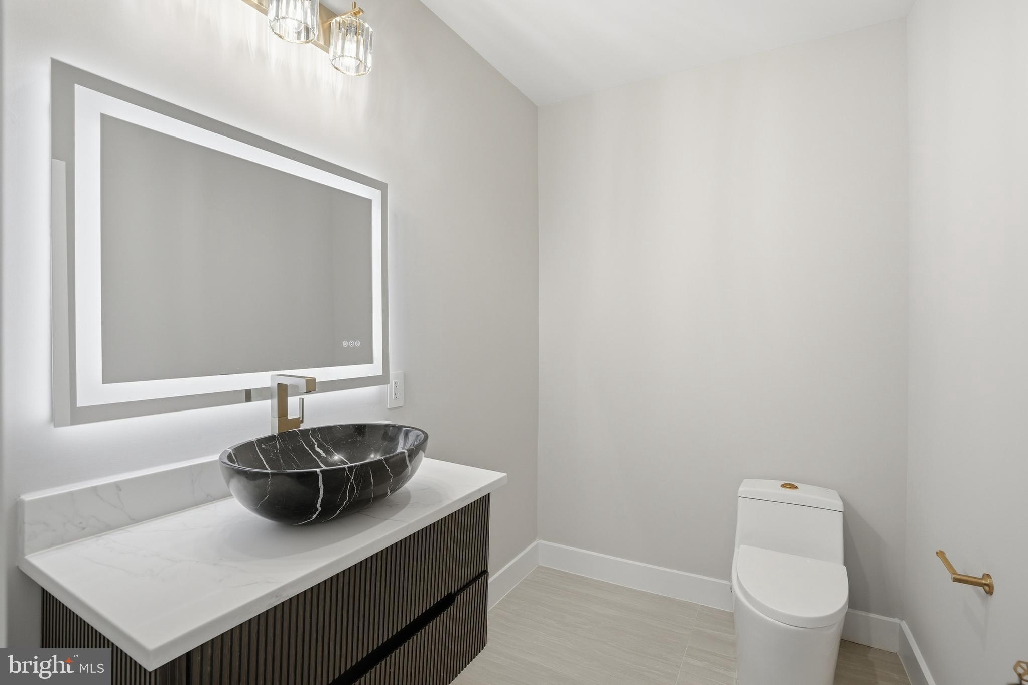 1805 Franklin Avenue McLean, VA 22101 - Photo 75 of 96 a bathroom with a sink and a mirror