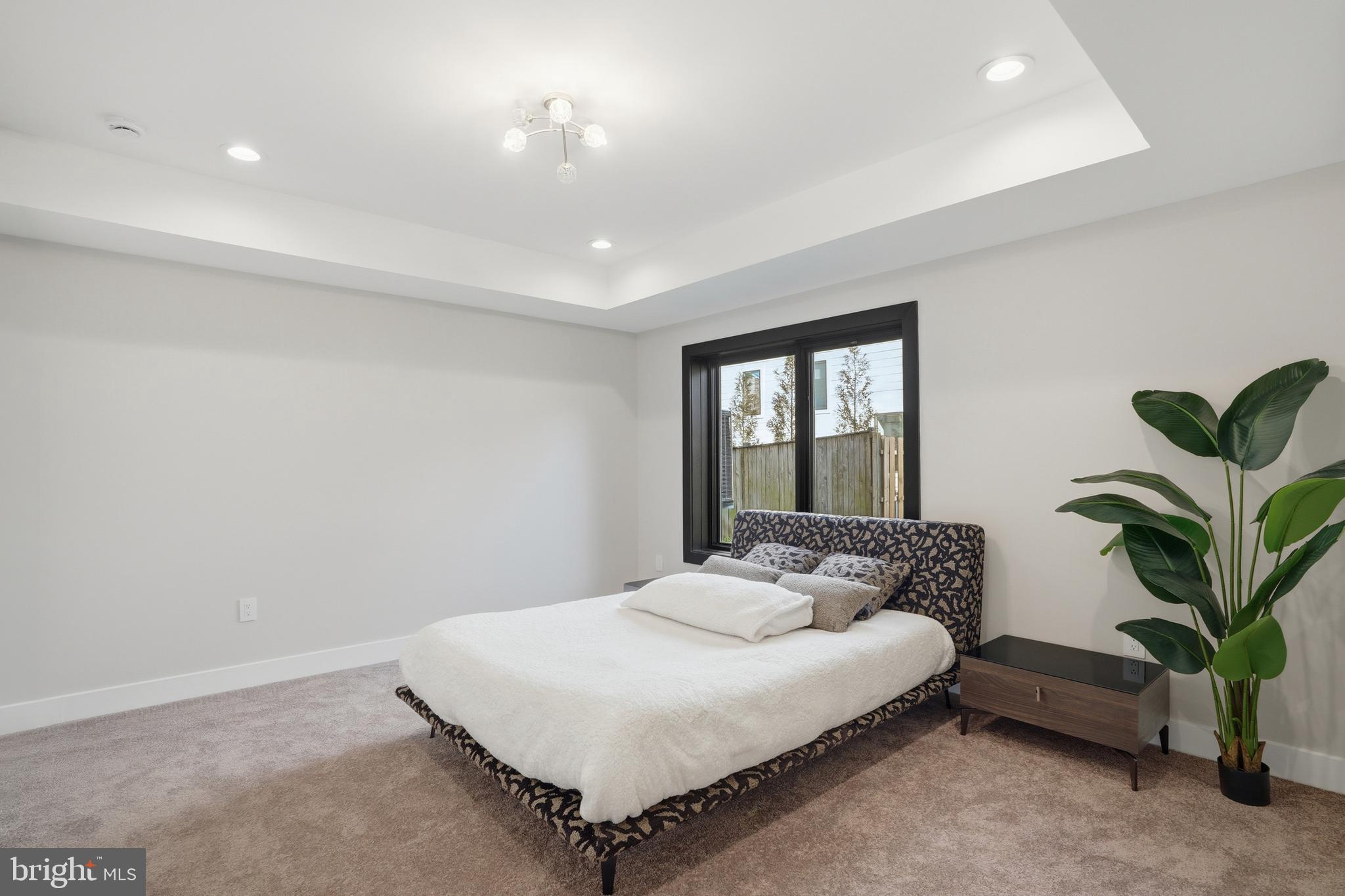 1805 Franklin Avenue McLean, VA 22101 - Photo 81 of 96 a bedroom with a bed and a potted plant