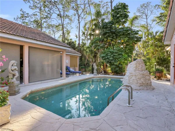 a view of a swimming pool with a patio