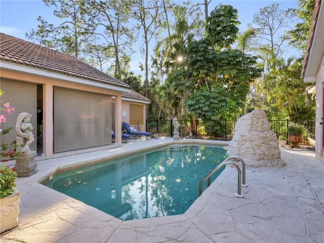 a view of a swimming pool with a patio