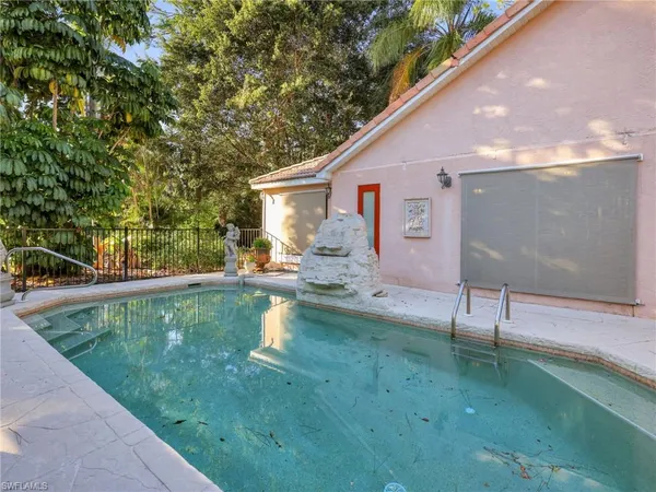 a view of backyard with swimming pool