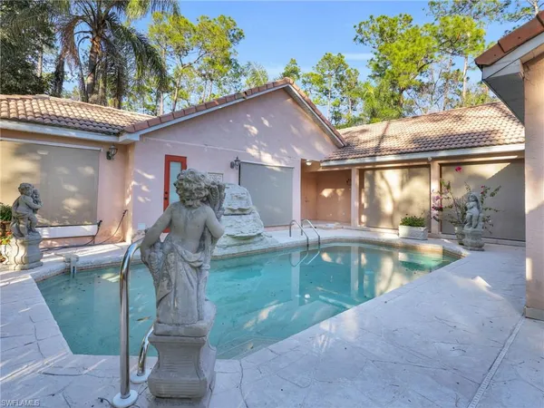a view of a house with a backyard porch and sitting area