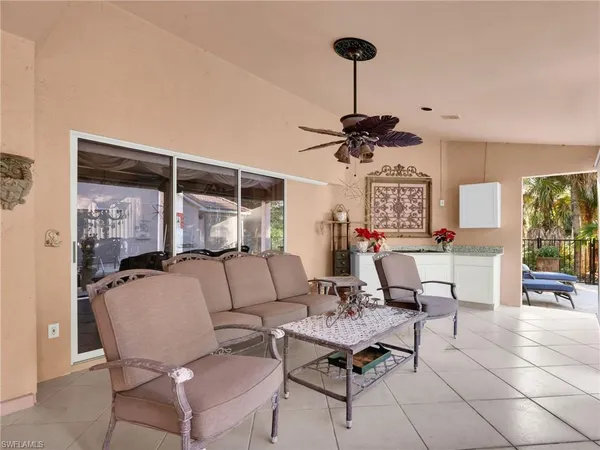 a living room with furniture a window and a table