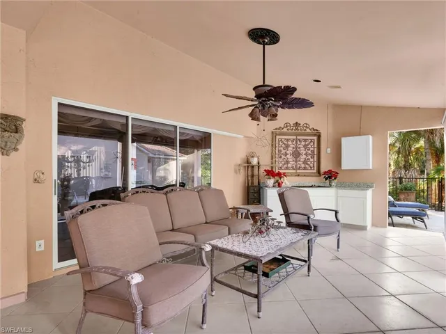 a living room with furniture a window and a table