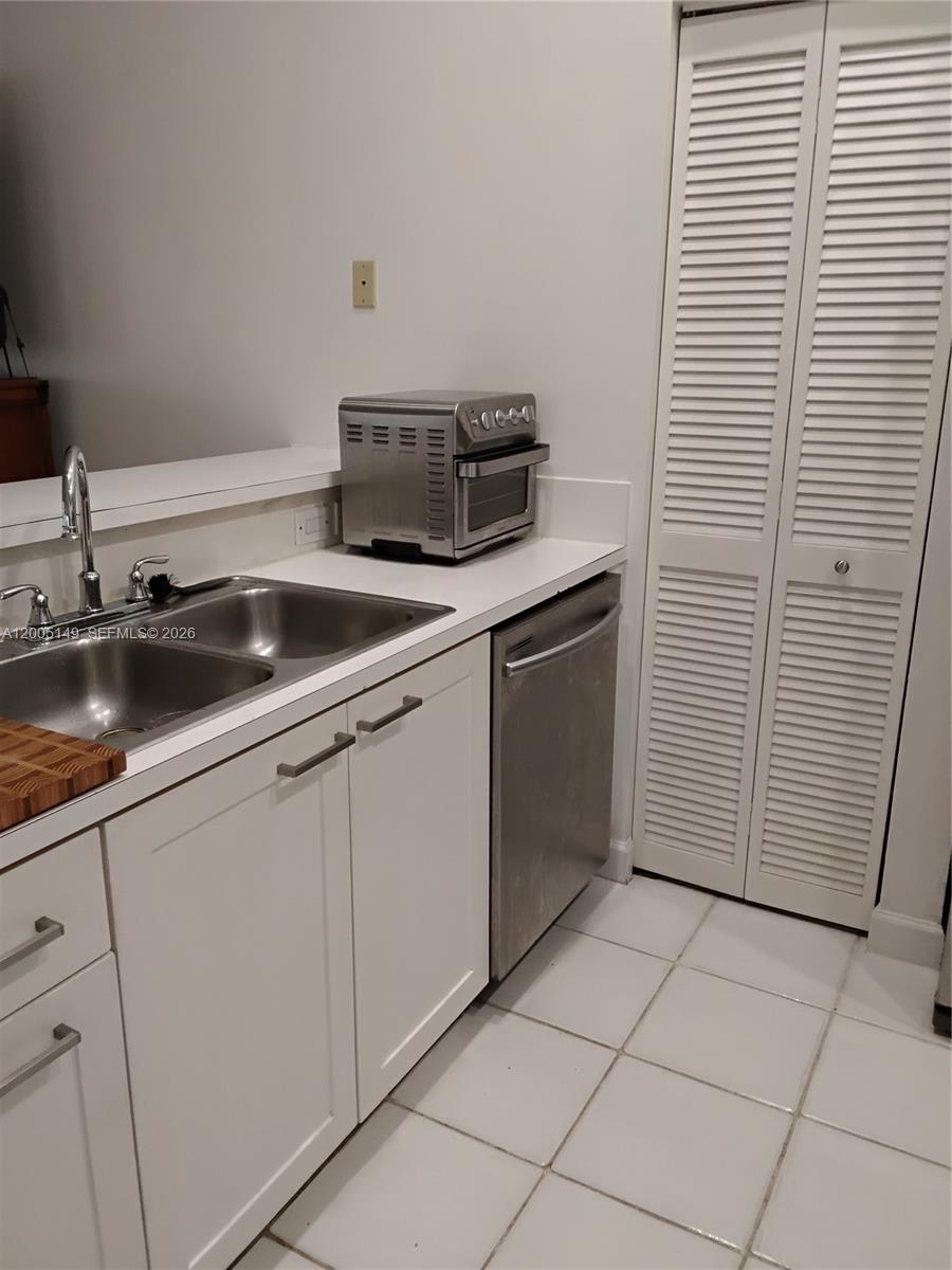 519 Talavera Road Weston, FL 33326 - Photo 12 of 19 a kitchen with a sink and cabinets