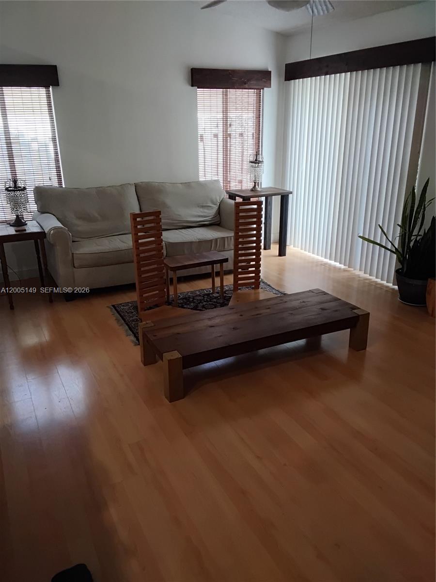 519 Talavera Road Weston, FL 33326 - Photo 13 of 19 a living room with furniture and wooden floor