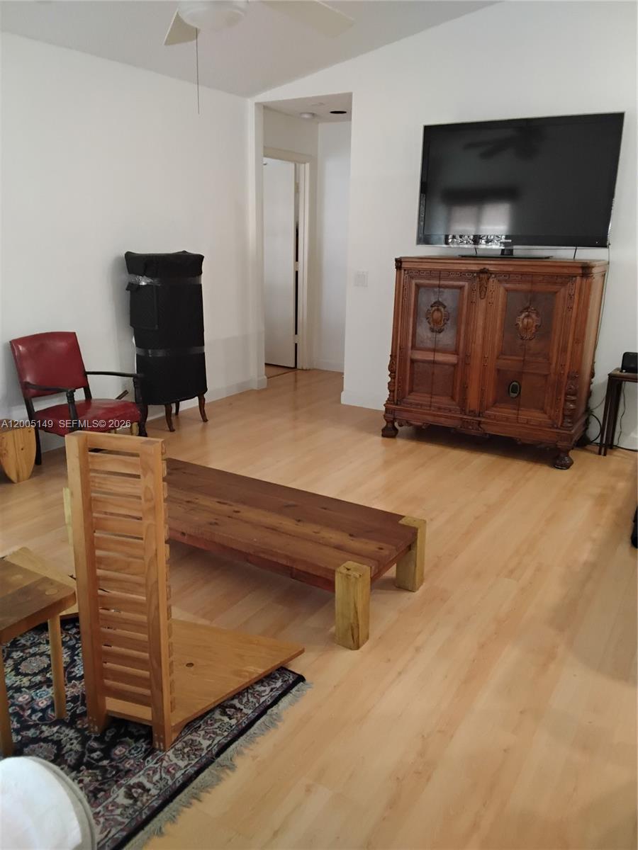519 Talavera Road Weston, FL 33326 - Photo 14 of 19 a room with furniture and flat screen tv