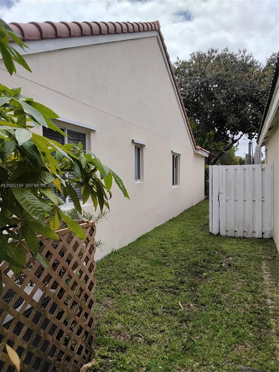 519 Talavera Road Weston, FL 33326 - Photo 4 of 19 a view of a backyard