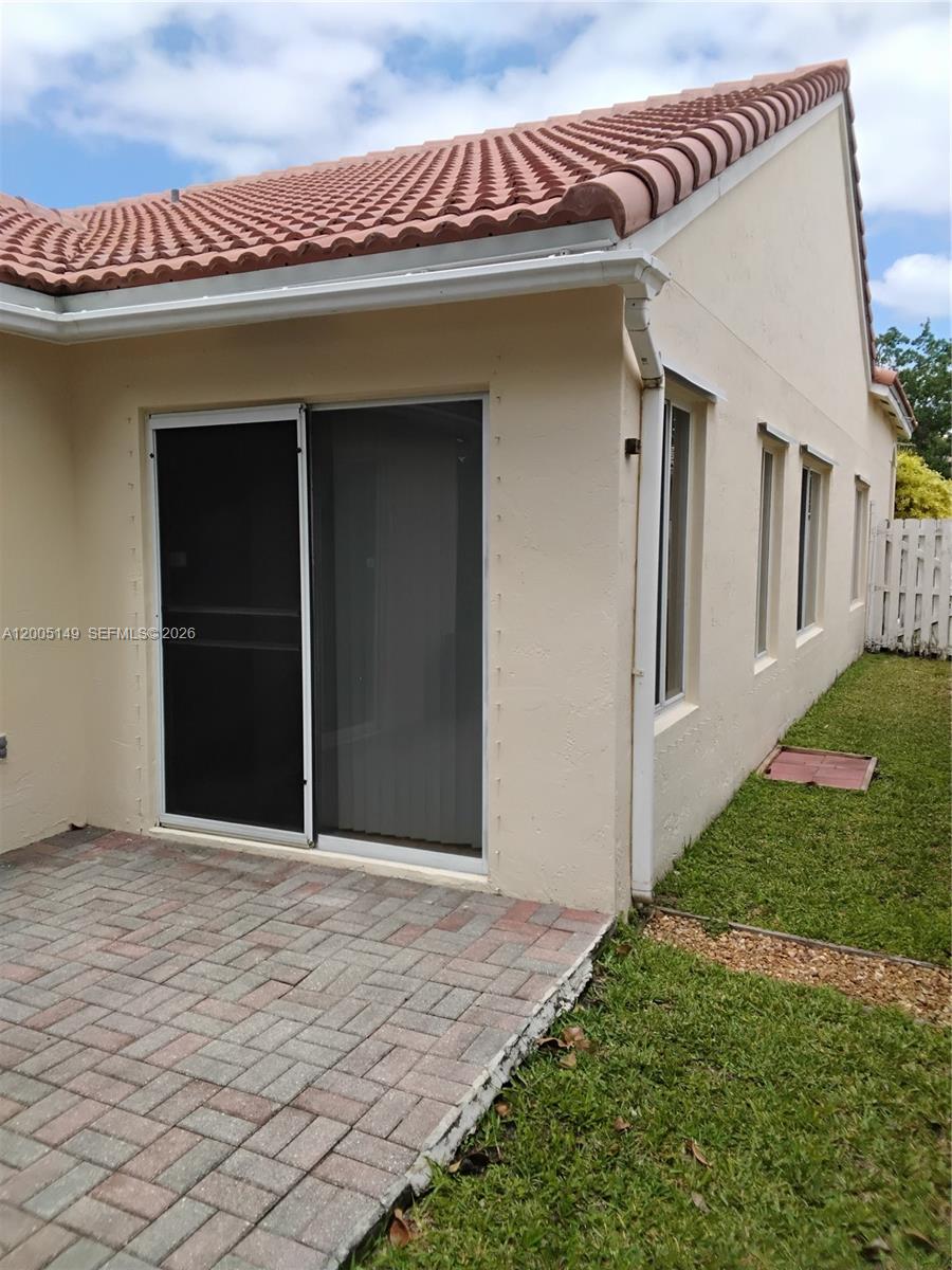 519 Talavera Road Weston, FL 33326 - Photo 7 of 19 a view of a house with a yard
