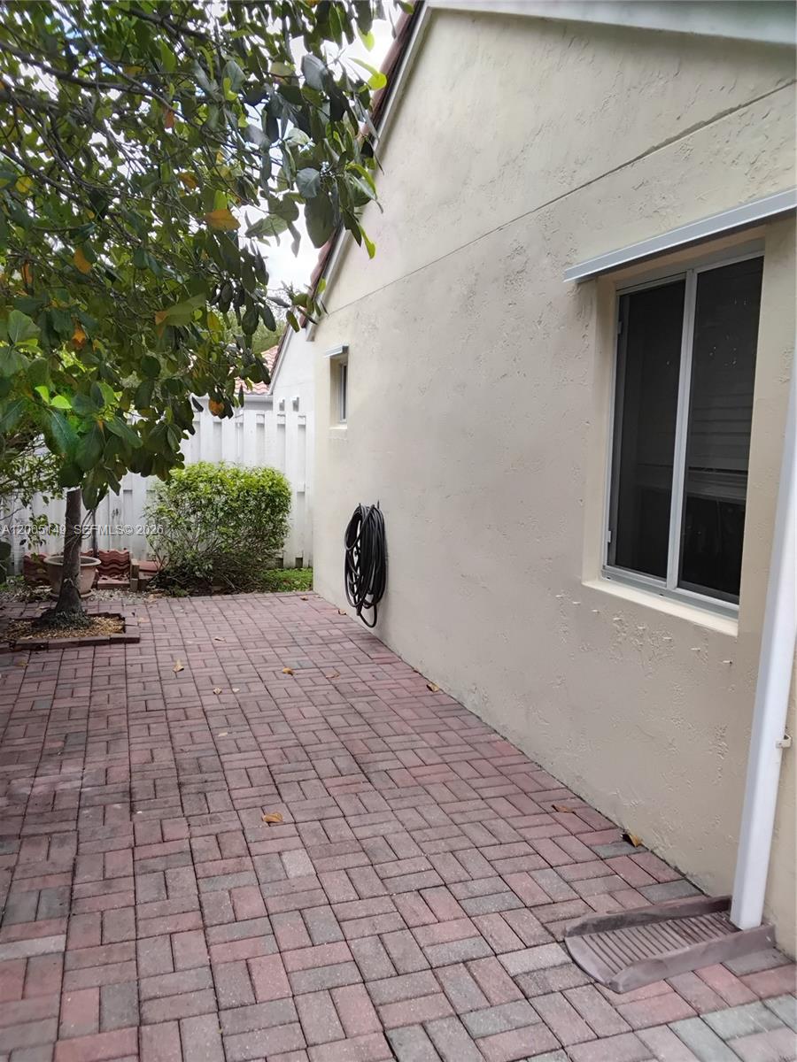 519 Talavera Road Weston, FL 33326 - Photo 8 of 19 a view of a backyard of the house