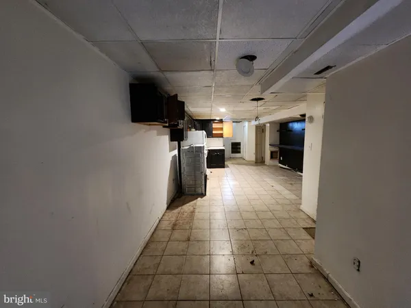 a kitchen with stainless steel appliances granite countertop a refrigerator and a stove