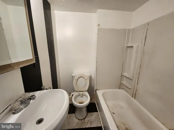 a kitchen with stainless steel appliances a refrigerator and a stove top oven
