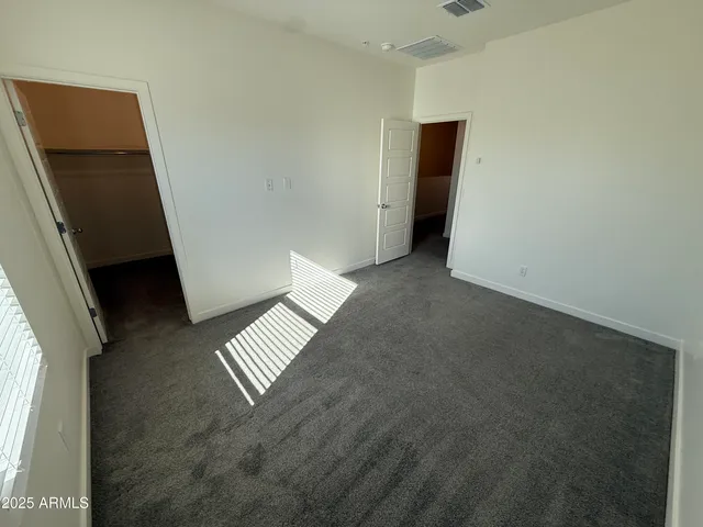 a bathroom with a sink and mirror with toilet