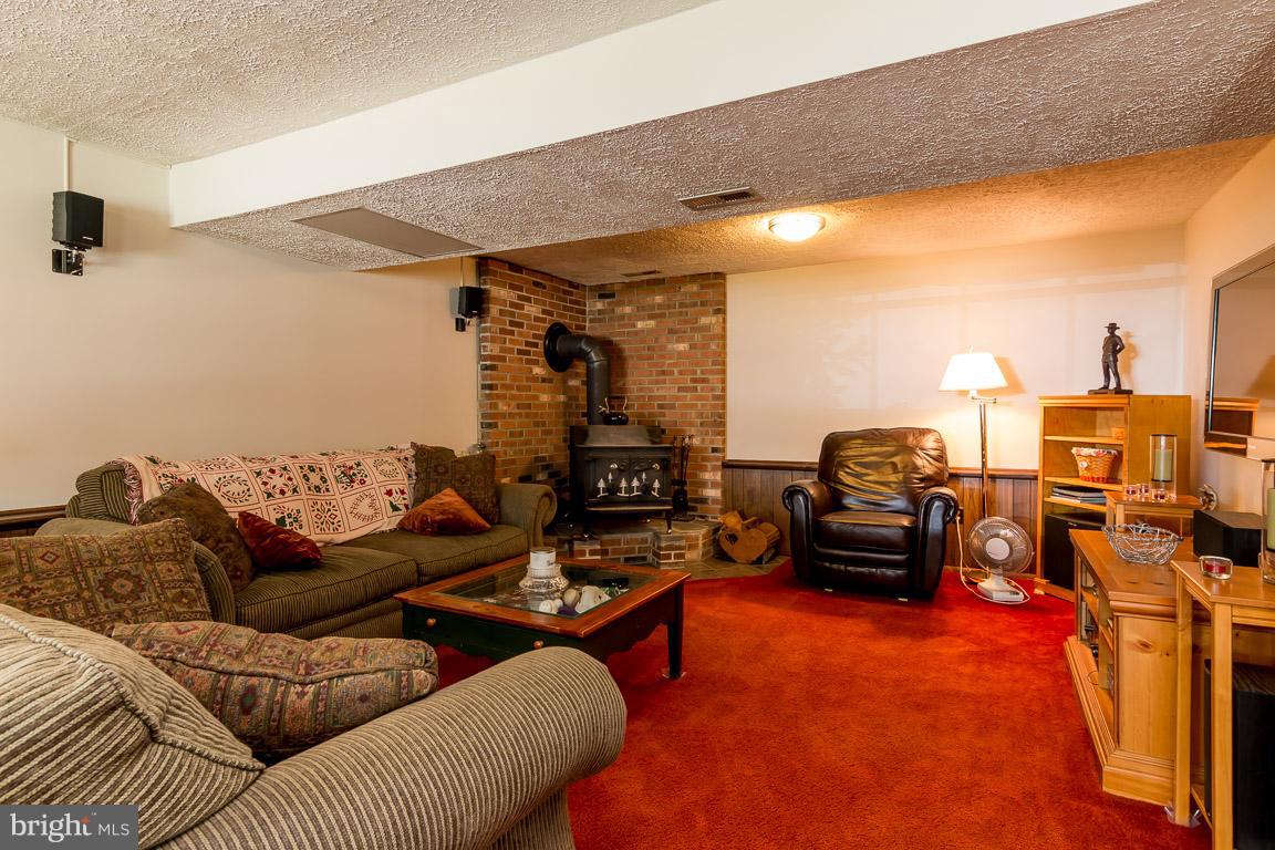 4540 Ambermill Road Baltimore, MD 21236 - Photo 25 of 30 Family Room w/ wood stove