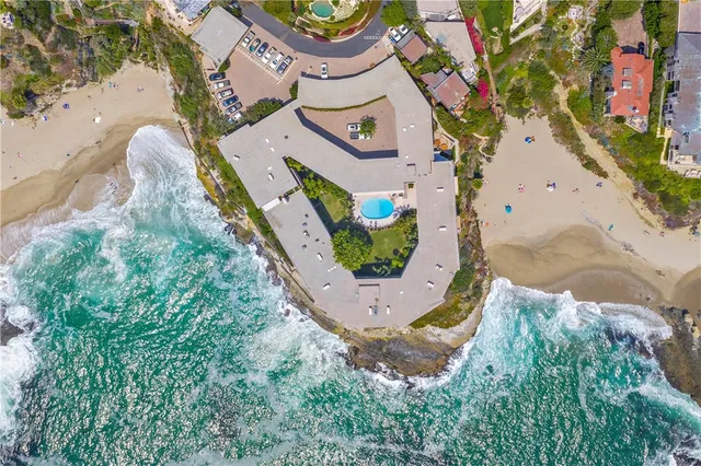 a view of a lake with houses in the background
