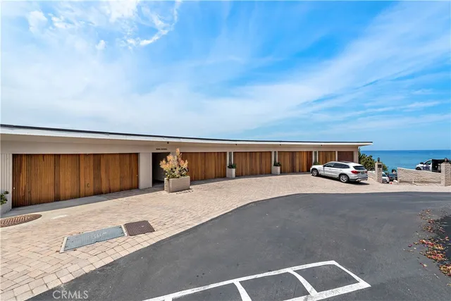 an aerial view of a house with a ocean view