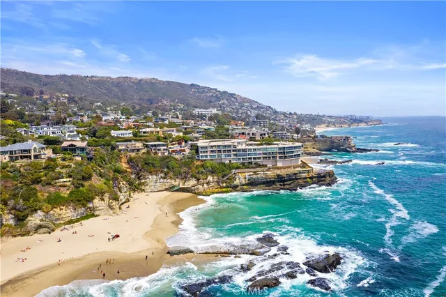 an aerial view of a house with a ocean view
