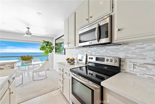 a kitchen with a stove and a microwave