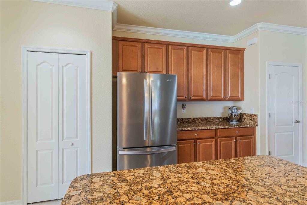 20370 Grazie Place Venice, FL 34293 - Photo 20 of 86 a kitchen with stainless steel appliances granite countertop a refrigerator and a sink