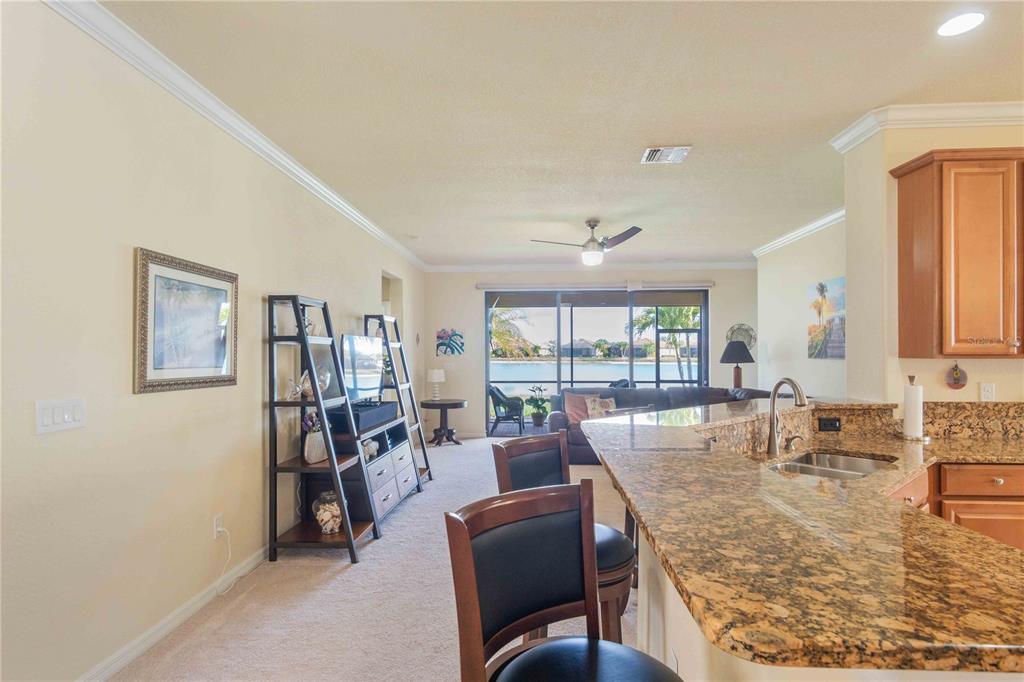 20370 Grazie Place Venice, FL 34293 - Photo 24 of 86 a view of a dining room with furniture window and outside view
