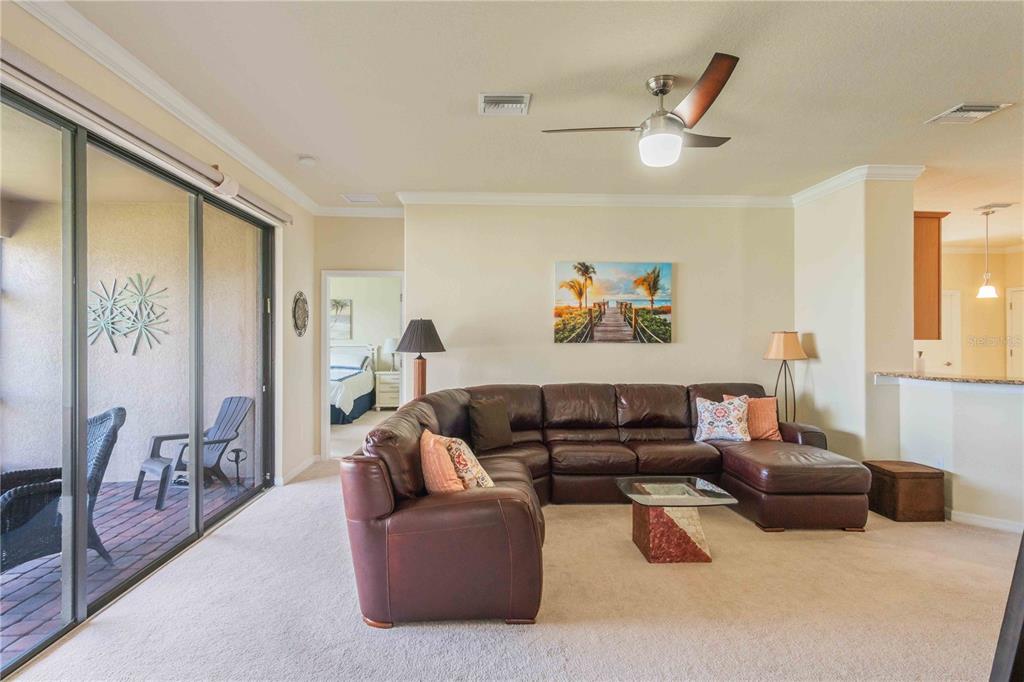 20370 Grazie Place Venice, FL 34293 - Photo 35 of 86 a living room with furniture and a large window