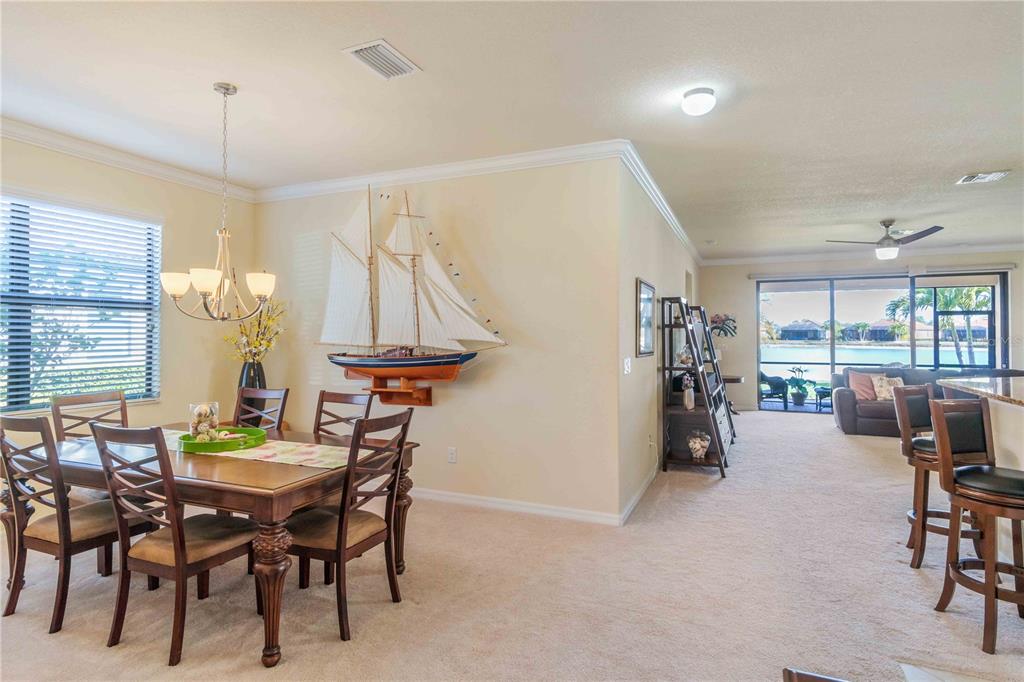20370 Grazie Place Venice, FL 34293 - Photo 38 of 86 a view of a dining room with furniture and a chandelier