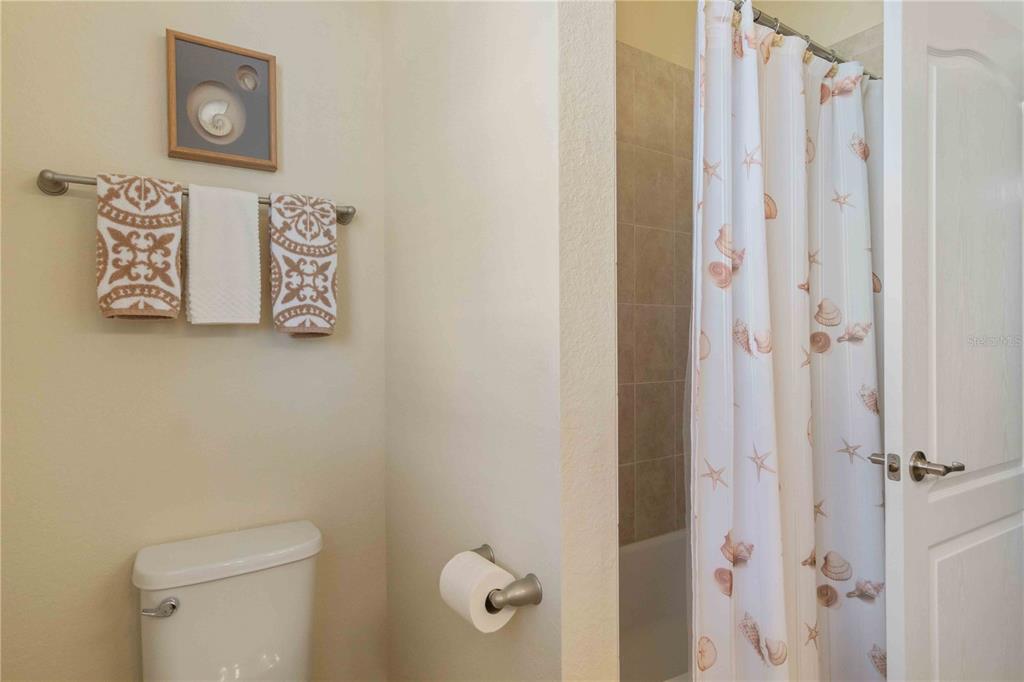 20370 Grazie Place Venice, FL 34293 - Photo 57 of 86 a bathroom with a shower and a toilet