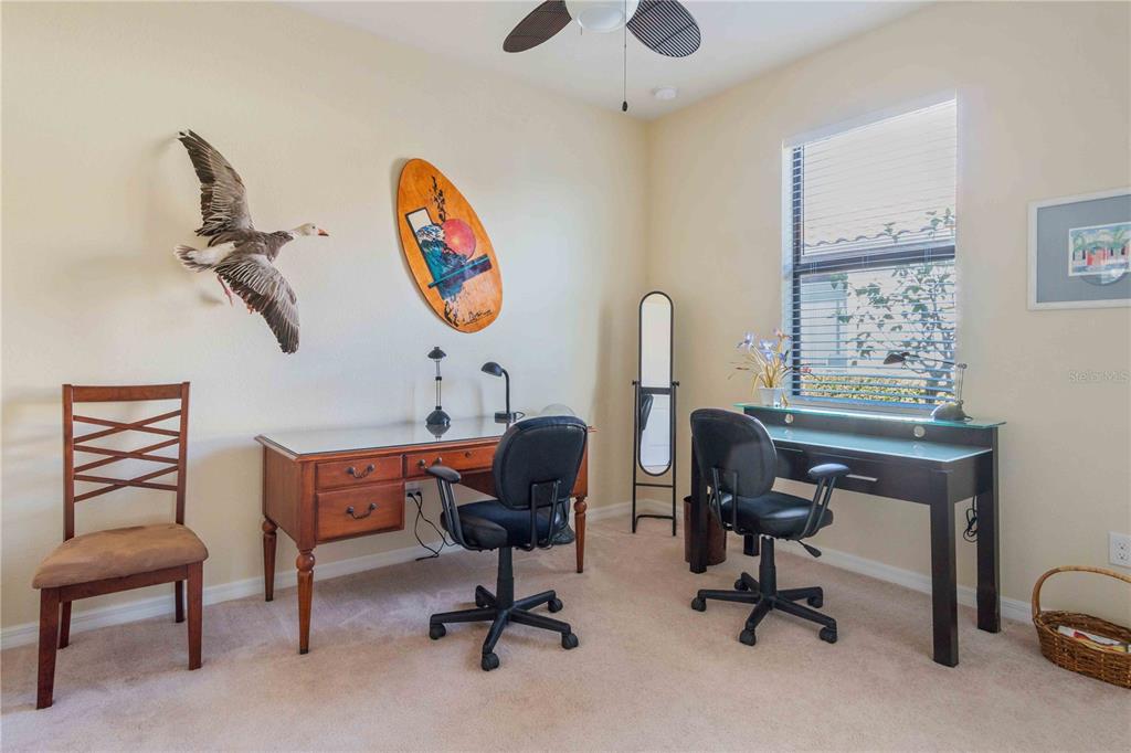 20370 Grazie Place Venice, FL 34293 - Photo 59 of 86 a view of a workspace with furniture and a window