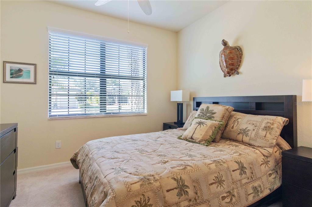 20370 Grazie Place Venice, FL 34293 - Photo 63 of 86 a bedroom with a bed and a window