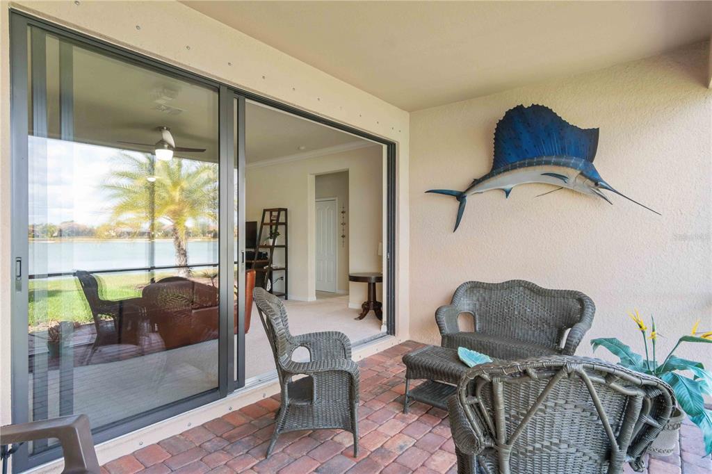 20370 Grazie Place Venice, FL 34293 - Photo 74 of 86 a living room with furniture and a window