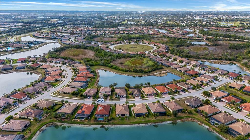 20370 Grazie Place Venice, FL 34293 - Photo 76 of 86 an aerial view of residential houses with outdoor space