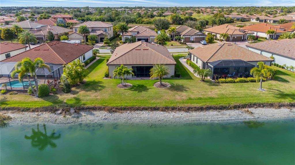 20370 Grazie Place Venice, FL 34293 - Photo 79 of 86 an aerial view of residential houses with outdoor space and river