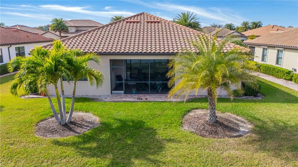 20370 Grazie Place Venice, FL 34293 - Photo 81 of 86 a front view of a house with garden