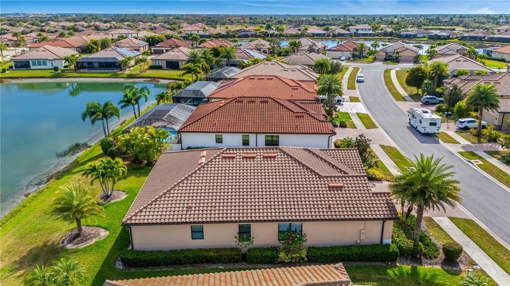 20370 Grazie Place Venice, FL 34293 - Photo 84 of 86 an aerial view of residential houses with outdoor space and swimming pool